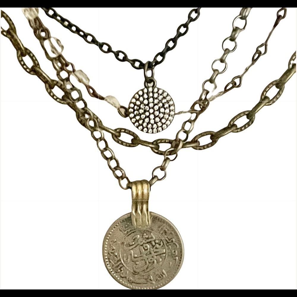 A local artisan handcrafted this unique layered necklace. Original One-a-Kind.